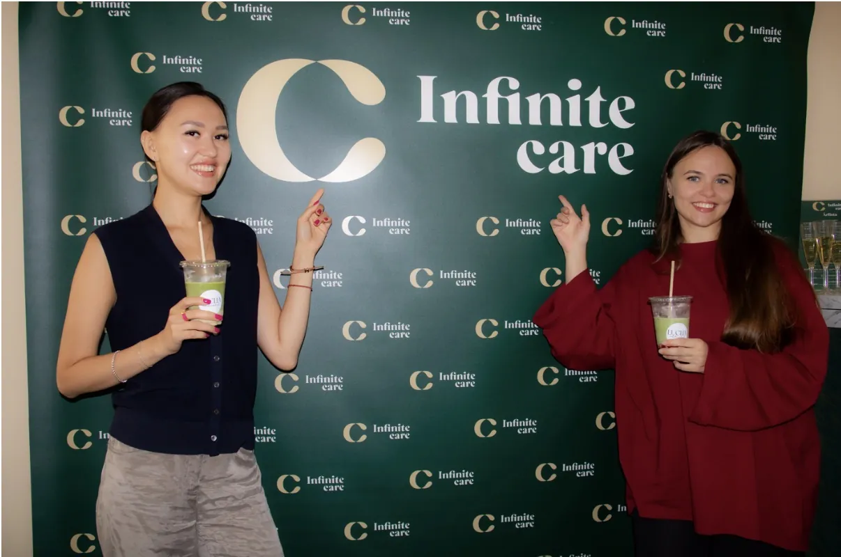 Guests in front of the Infinite Care backdrop